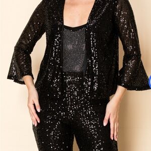 NWOT Stunning Black Sequin bolero style jacket with bell sleeves.Size small